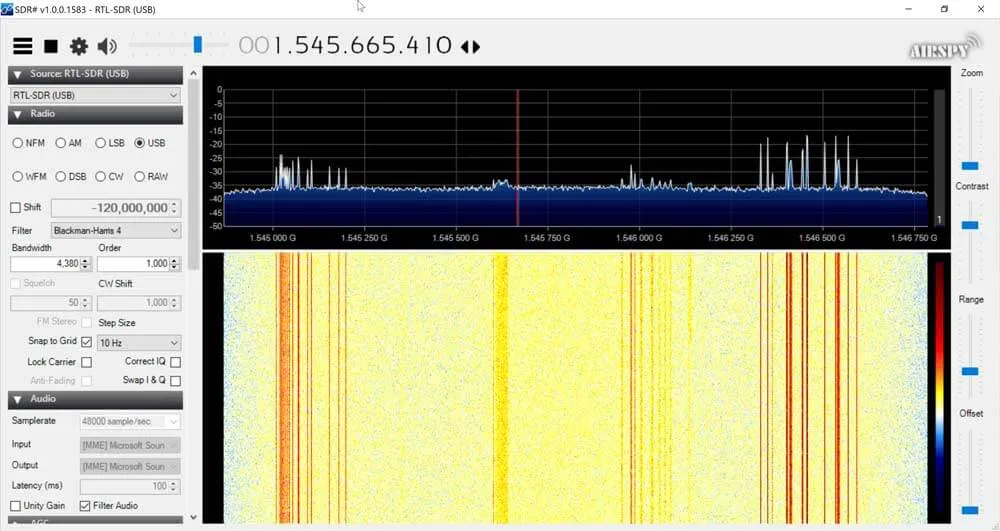 A spectrum and waterfall display showing L-band satellite signals received with the V-dipole and reflector.