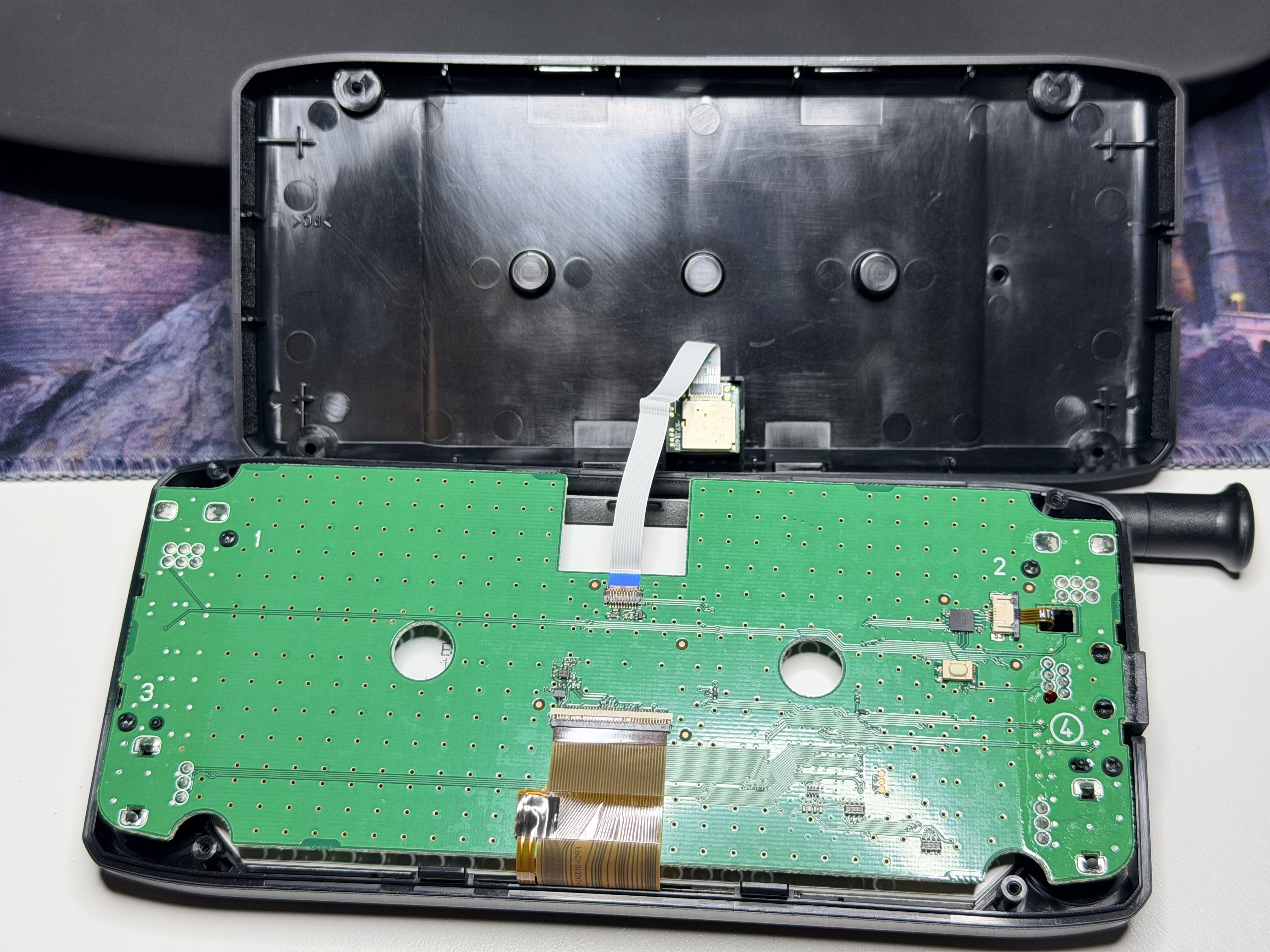 ID-5100A head unit opened with the PCB and internal ribbon cables exposed.