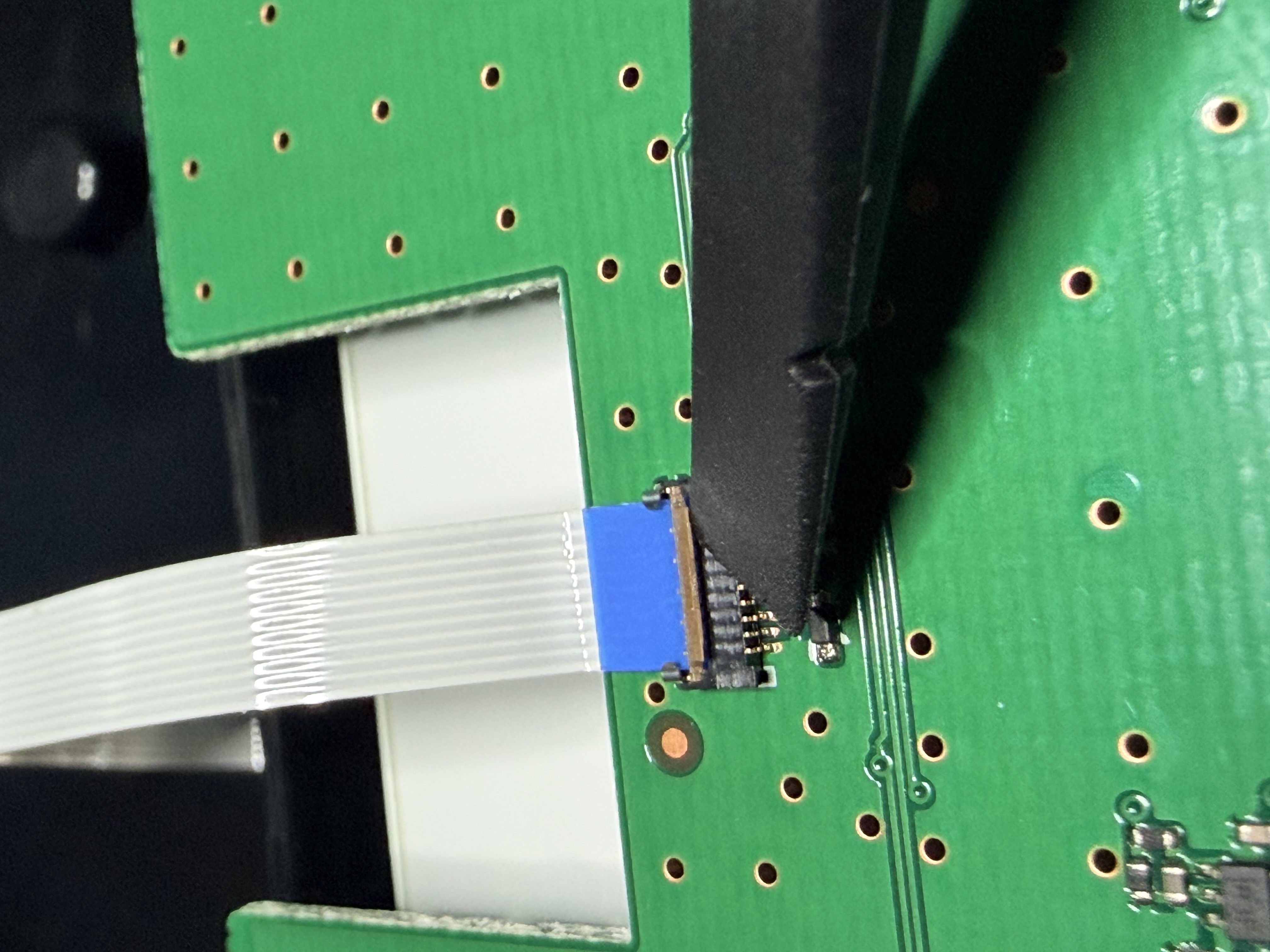 Ribbon cable being reconnected during final reassembly of the ID-5100A head unit.