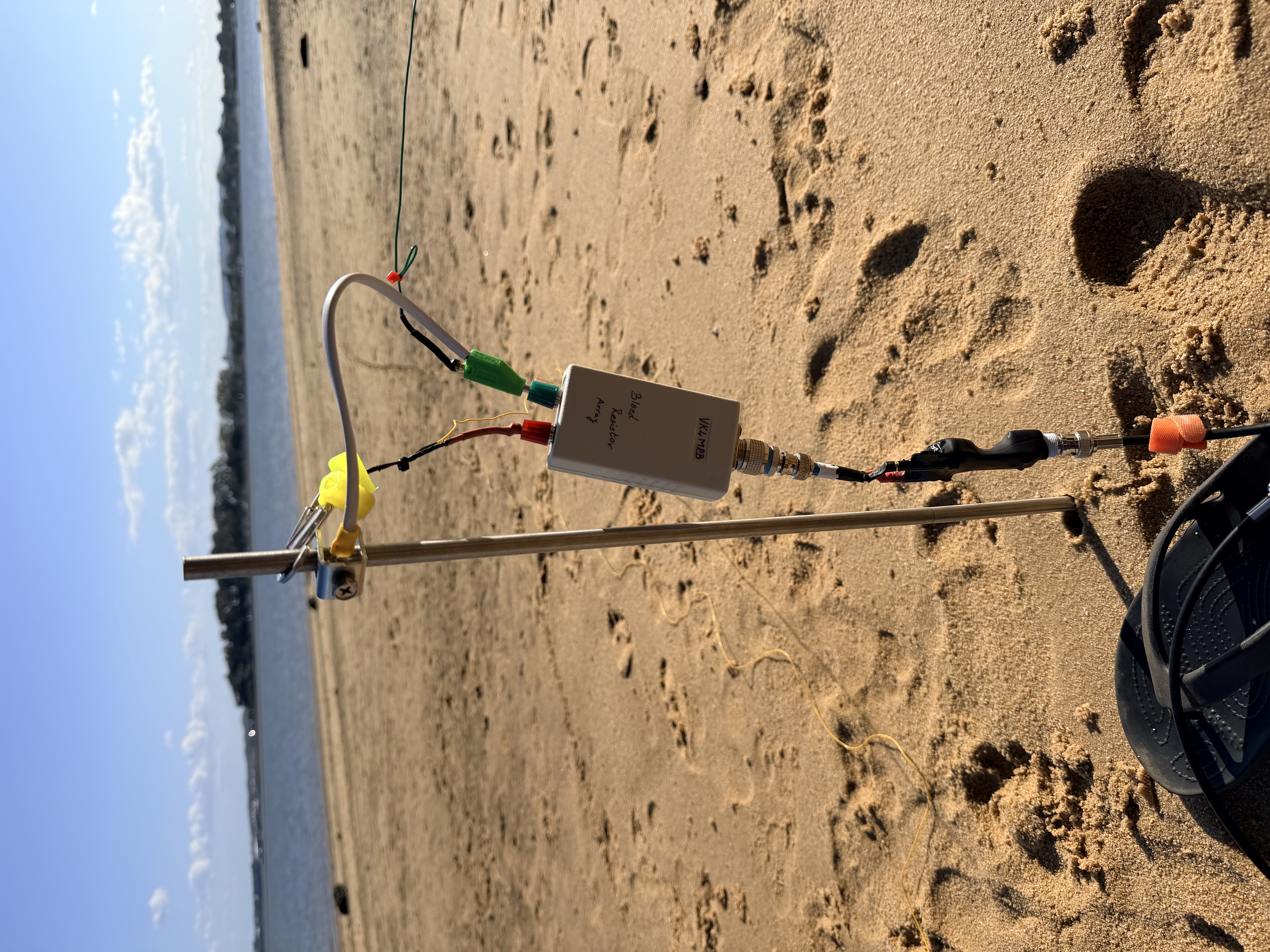 Feedpoint, radial connection, and bleed path mounted on a beach stake