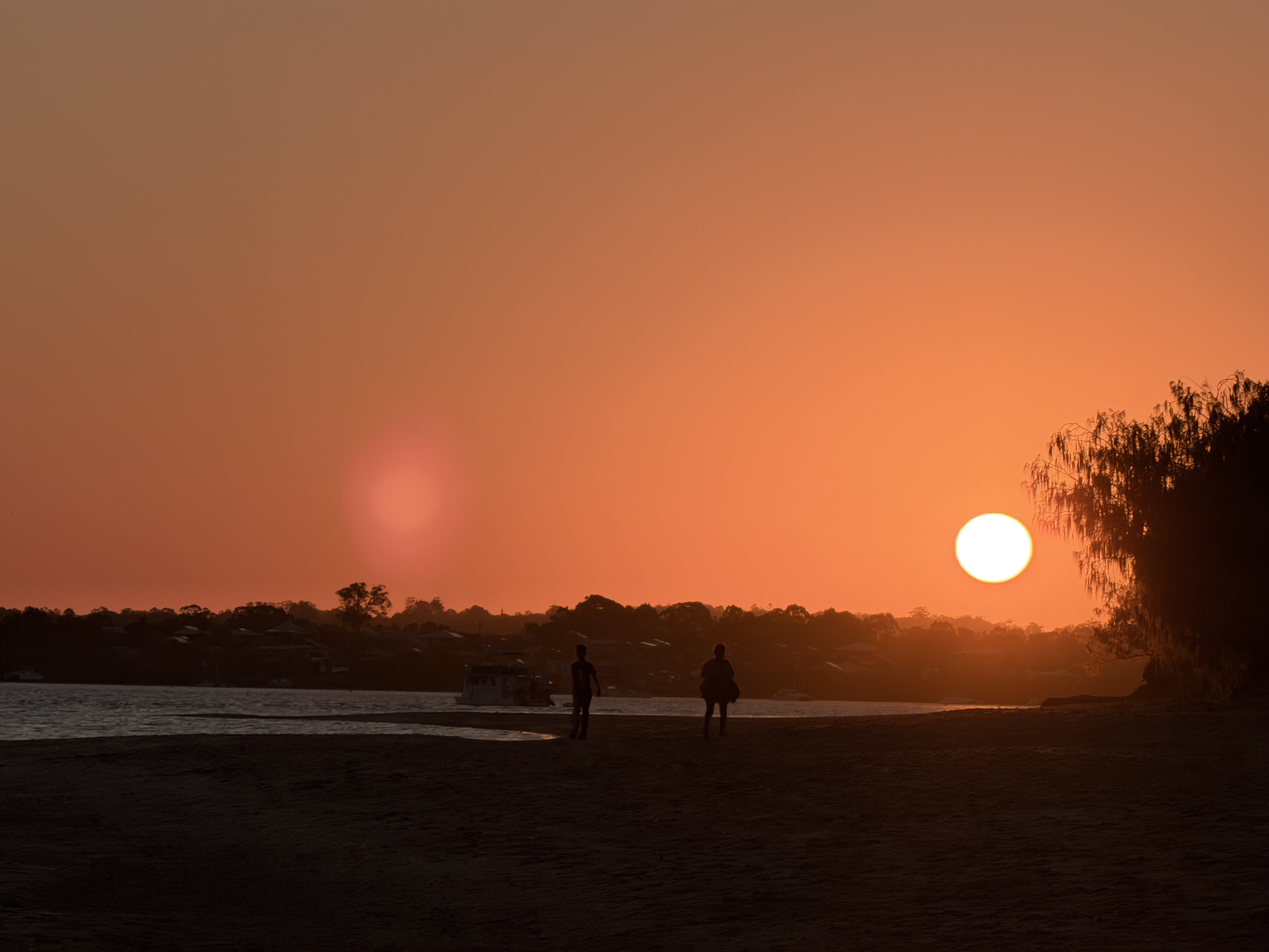 Sunset silhouette on the shoreline after the activation