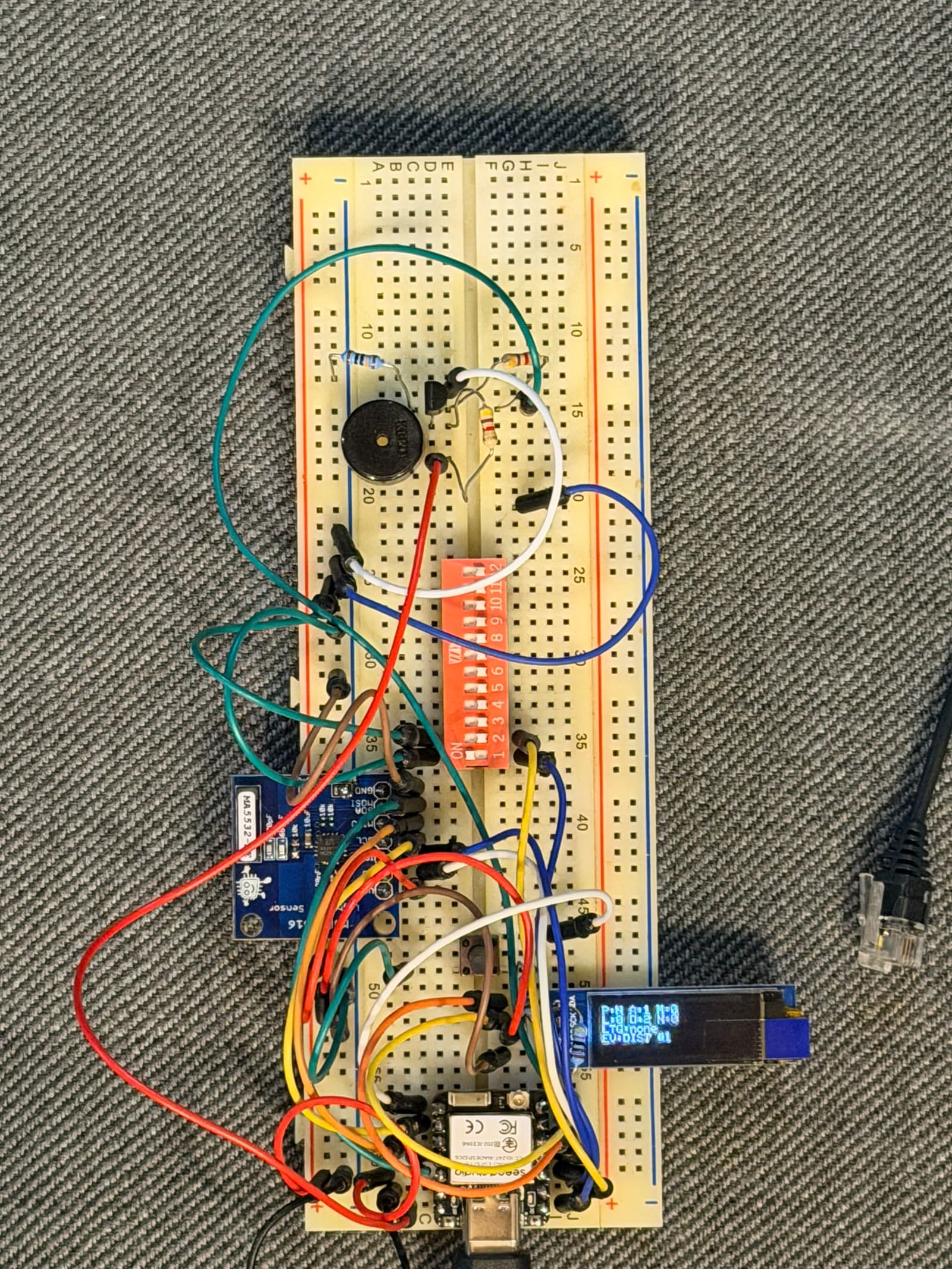Full breadboard prototype of the lightning warning box with XIAO ESP32-C6, AS3935, OLED, and buzzer stage