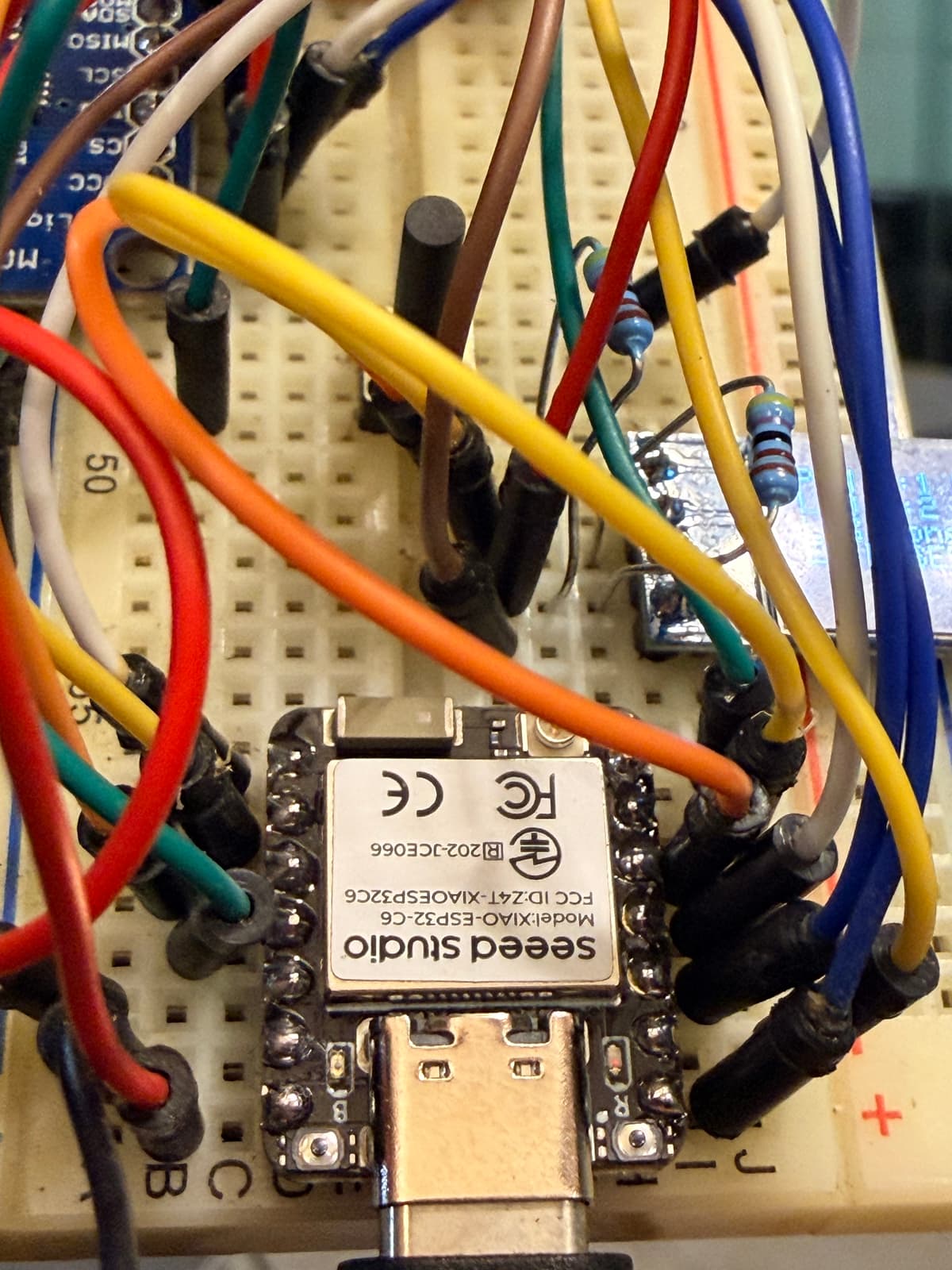 Close-up of XIAO ESP32-C6 wiring on breadboard