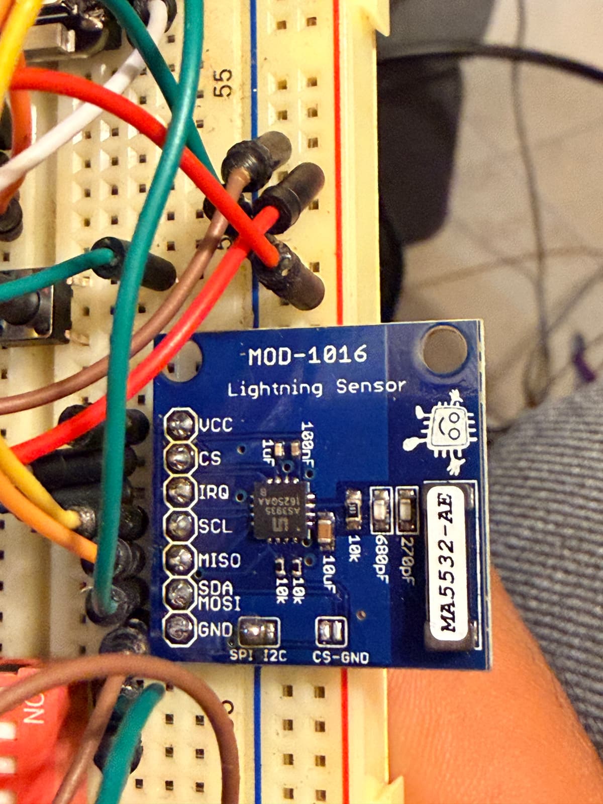 AS3935 sensor module close-up showing pin labels and bench wiring
