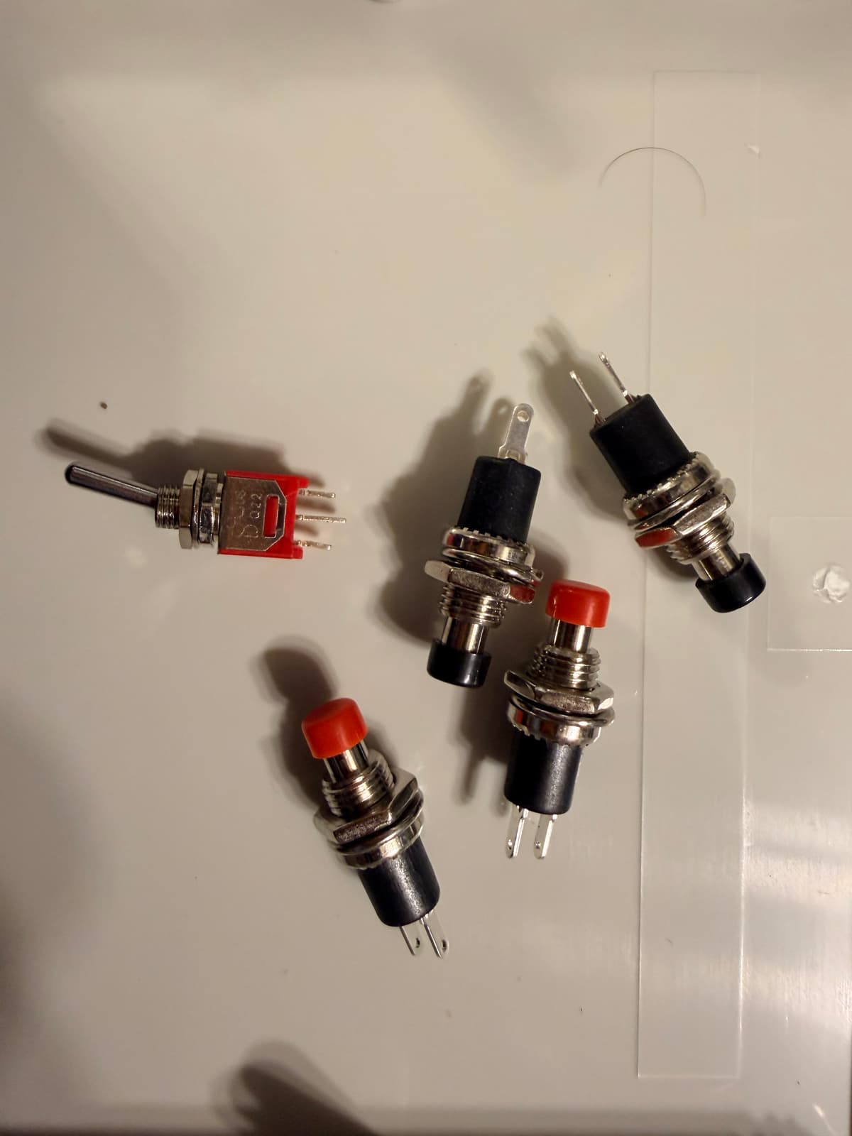 Panel toggle and pushbutton controls for arm mute and reset