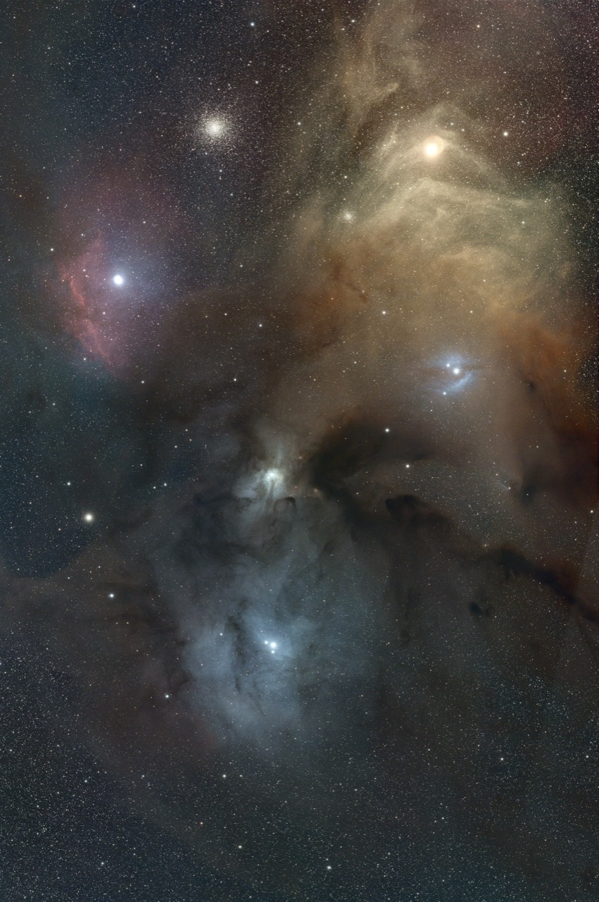 Reprocessed Rho Ophiuchi cloud complex showing reflection nebulosity, dark dust and colourful stars.